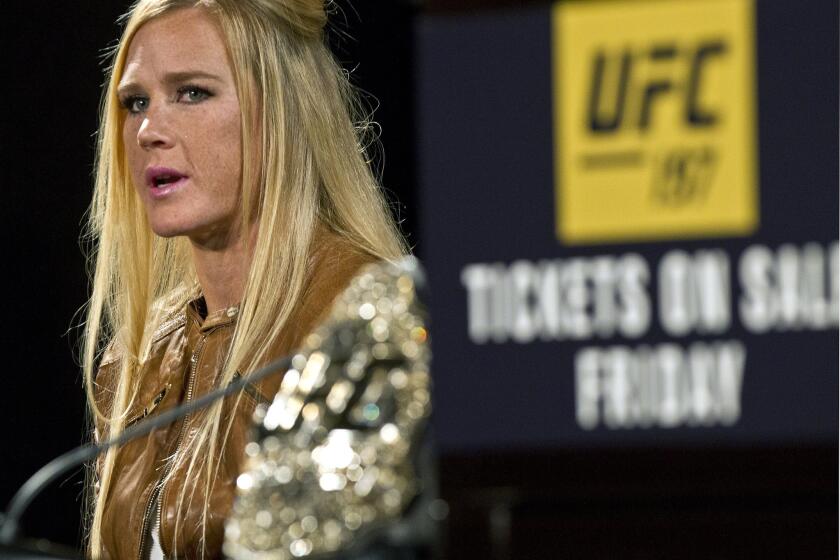 UFC 197 fighter Holly Holm answers a question during a news conference at the MGM Grand in Las Vegas.