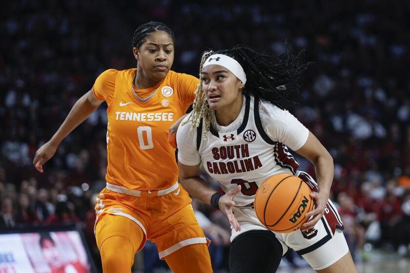 South Carolina guard Te-Hina Paopao, right, drives against Tennessee guard Jewel Spear during the first half of an NCAA college basketball game in Columbia, S.C., Sunday, March 3, 2024. (AP Photo/Nell Redmond)