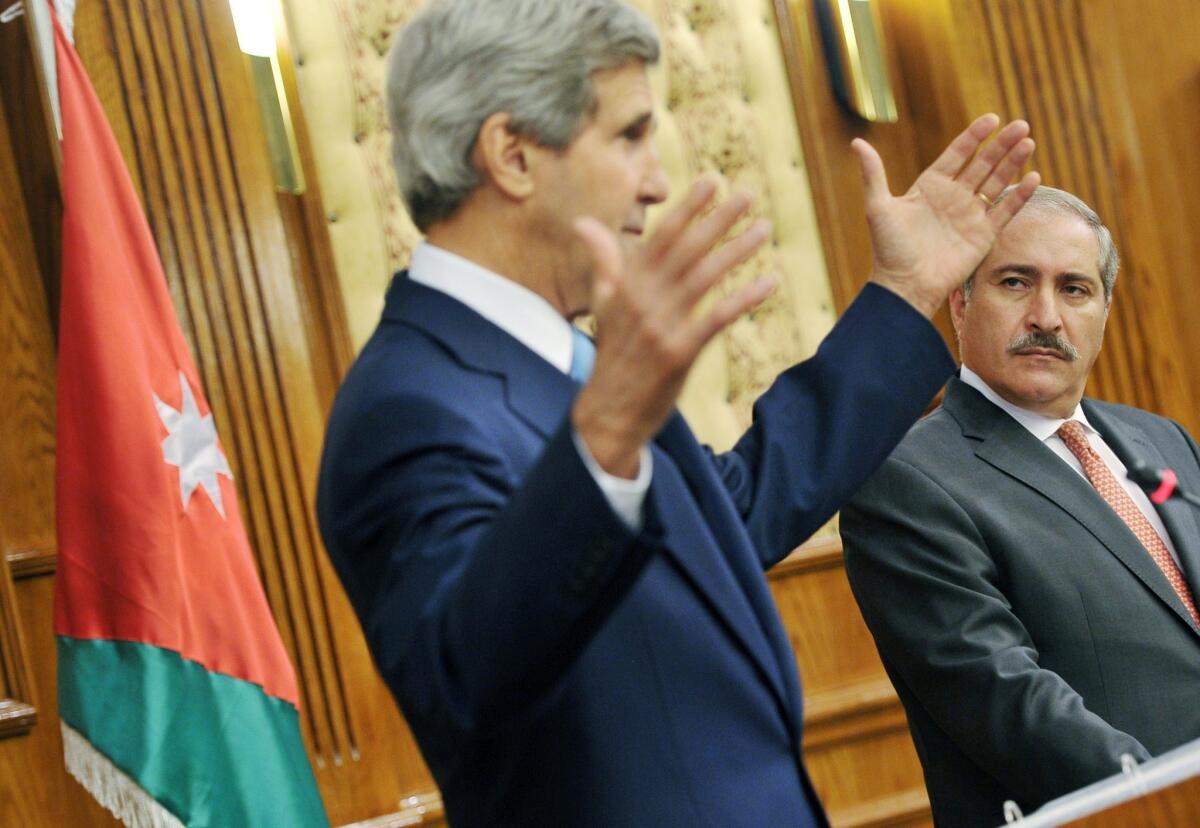 Jordanian Foreign Minister Nasser Judeh watches as U.S. Secretary of State John F. Kerry answers questions following his meeting with Arab League officials.