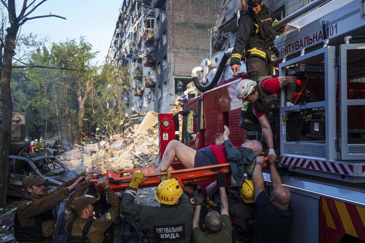 Rescue workers evacuate an injured man