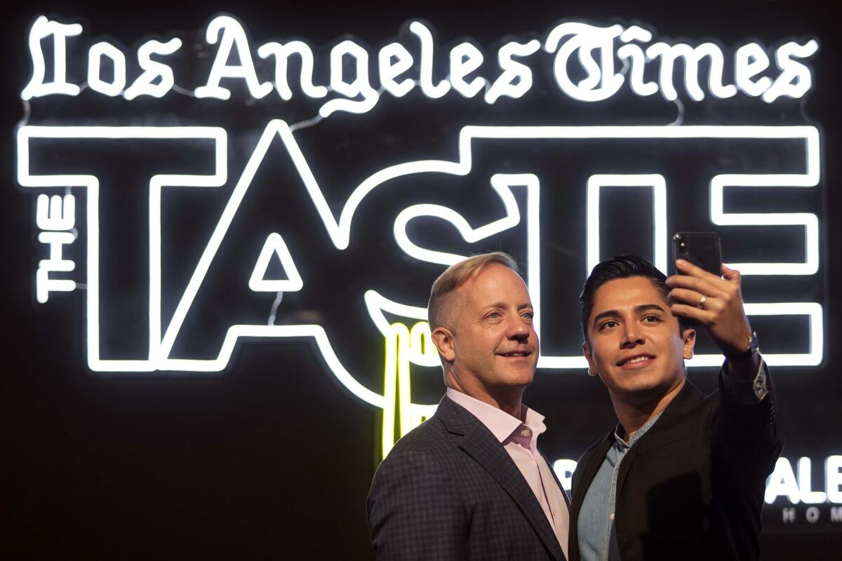 Timothy Wagner, left, and Alsonso Cordova of Long Beach stop by for a selfie on the red carpet.