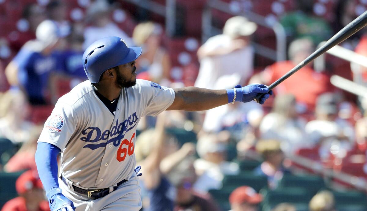 Dodgers right fielder Yasiel Puig (66) watches his third home run of the game, a three-run shot, against the Cardinals on Saturday.