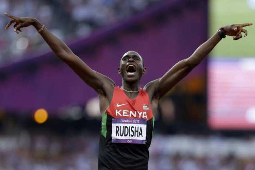 David Rudisha celebrates after setting a world record in the men's 800 meters.
