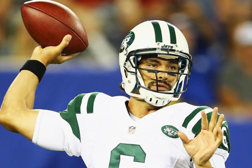 Mark Sanchez, quarterbacking for the New York Jets, throws a pass during a preseason game against the New York Giants on Aug. 24, 2013. Sanchez signed a one-year deal with the Philadelphia Eagles on Friday.