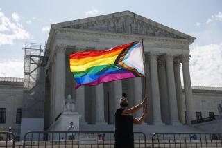 WASHINGTON, DC - JUNE 26: Same-sex marriage supporter Vin Testa, of Washington, DC, waves a LGBTQIA pride flag in front of the U.S. Supreme Court Building as he makes pictures with his friend Donte Gonzalez to celebrate the anniversary of the United States v. Windsor and the Obergefell v. Hodges decisions on June 26, 2023 in Washington, DC. Today marks the 8th anniversary of the Supreme Court's ruling in the Obergefell v. Hodges case that guaranteed the right to marriage for same-sex couples. (Photo by Anna Moneymaker/Getty Images)