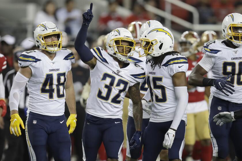 Los Angeles Chargers' Nasir Adderley (32) celebrates with teammates after intercepting a pass against the San Francisco 49ers during the second half of an NFL preseason football game in Santa Clara, Calif., Thursday, Aug. 29, 2019. (AP Photo/Ben Margot)
