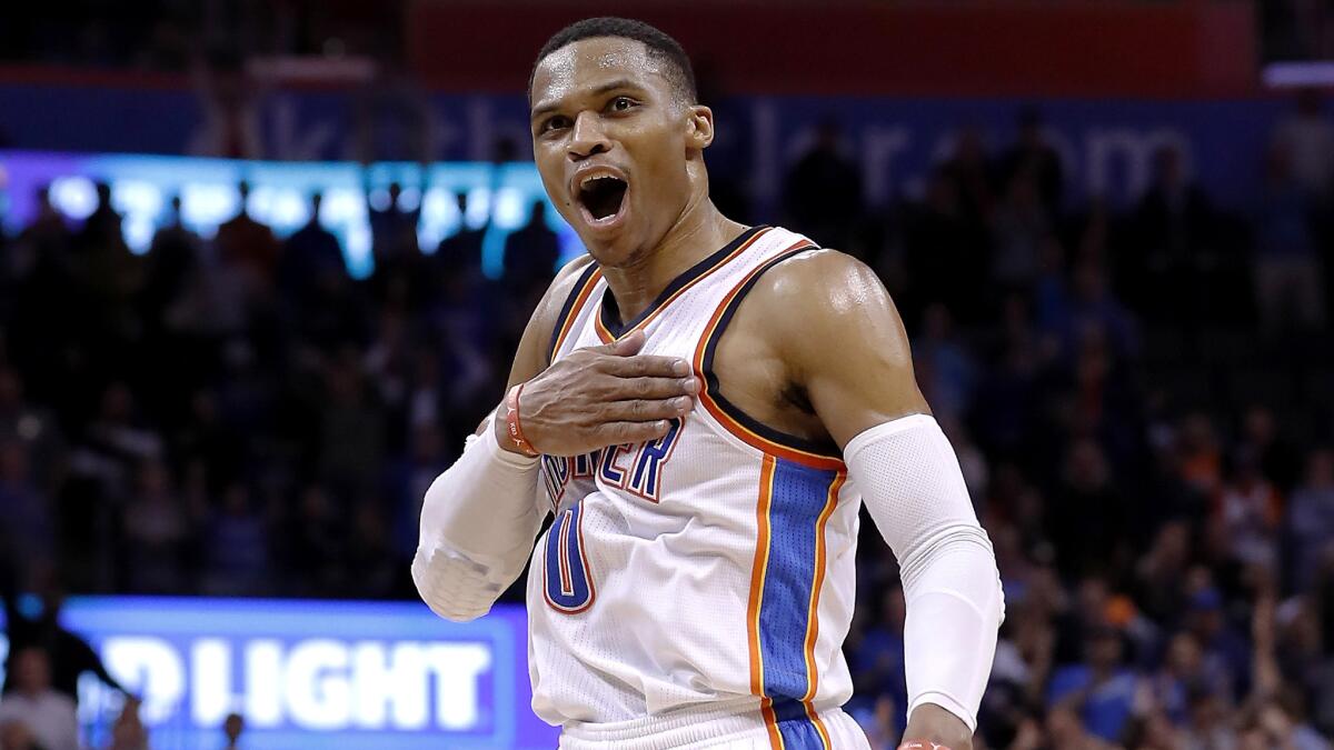 Thunder guard Russell Westbrook reacts after making a three-pointer against the Wizards during the second half Wednesday night.