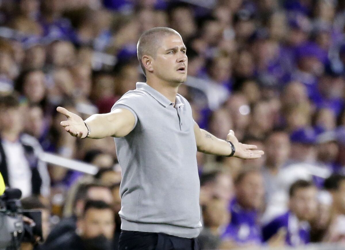 FILE - In this Aug. 26, 2017, file photo, Vancouver Whitecaps head coach Carl Robinson gestures to an official during the first half of an MLS soccer match against Orlando City, in Orlando, Fla. Former Wales midfielder Robinson has been hired as coach of the Western Sydney Wanderers in Australia's A-League Wednesday, Oct. 14, 2020. (AP Photo/John Raoux, File)