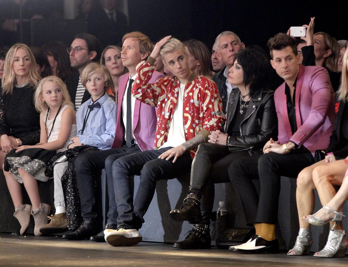 Musicians Beck in black tie, Justin Bieber, Joan Jett and Mark Ronson at the Saint Laurent fashion show by Hedi Slimane at the Hollywood Palladium.