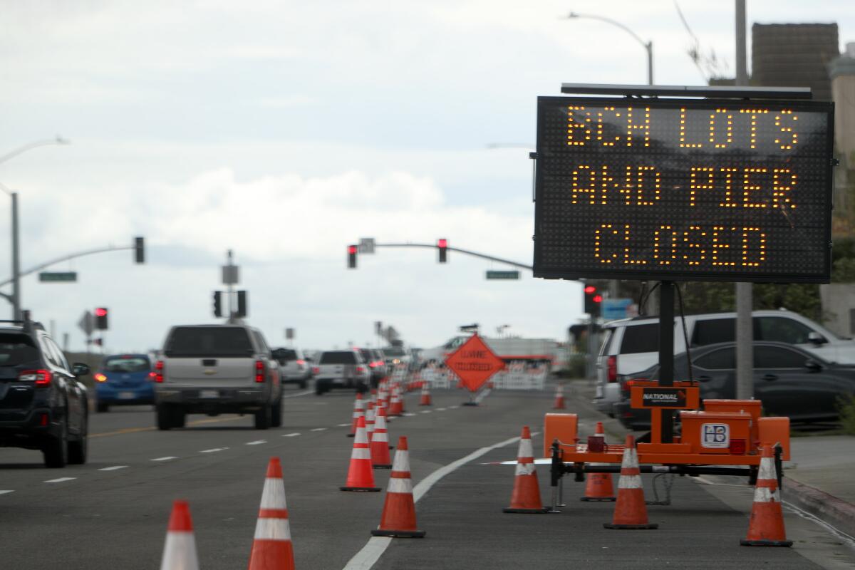 The city of Huntington Beach extended the closure of metered parking along Pacific Coast Highway to include both sides of the road, adding to earlier closures of beach parking lots and the pier.