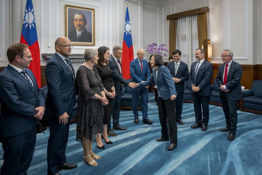In this photo released by the Taiwan Presidential Office, visiting Australian lawmakers is greeted by Taiwan's President Tsai Ing-wen at the Presidential Office in Taipei, Taiwan, Tuesday, Sept. 26, 2023. (Taiwan Presidential Office via AP)