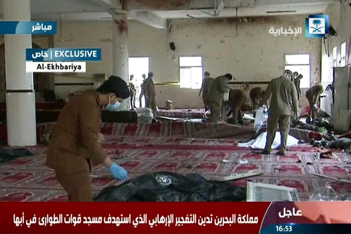 An image grab taken from Saudi TV on Thursday shows Saudi security forces inspecting the site of an explosion at a mosque in Abha, Saudi Arabia.