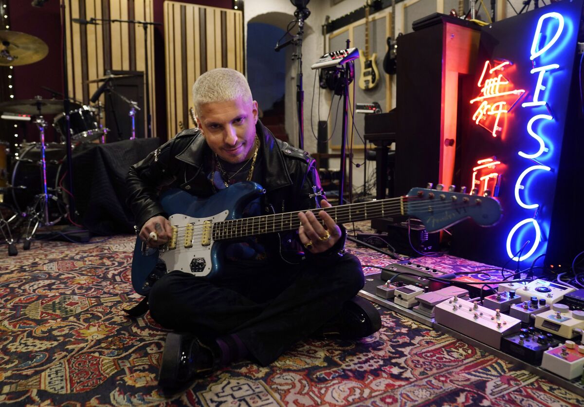 Music producer Andrew Watt poses for a portrait in his home recording studio, Wednesday, Oct. 13, 2021, in Beverly Hills, Calif. Watt, who has become one of pop music’s most sought-after hitmakers, has worked with Justin Bieber, Elton John, Dua Lipa, Miley Cyrus, Camila Cabello, and Post Malone. (AP Photo/Chris Pizzello)
