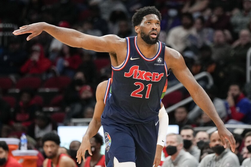 Philadelphia 76ers center Joel Embiid (21) reacts after teammate Isaiah Joe's three-point basket during the second half of an NBA basketball game against the Houston Rockets, Monday, Jan. 10, 2022, in Houston. (AP Photo/Eric Christian Smith)