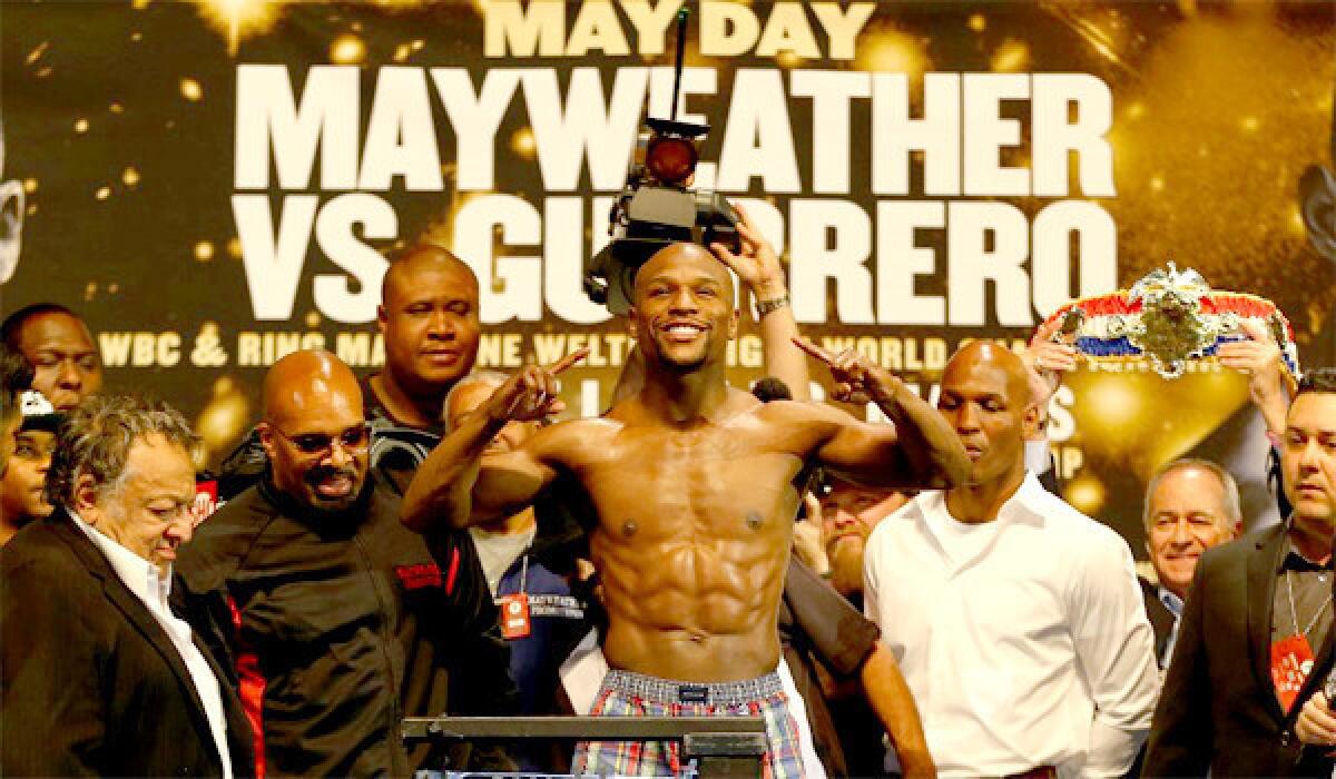 Floyd Mayweather Jr. smiles Friday during the weigh-in before his fight Saturday against Robert Guerrero in Las Vegas.