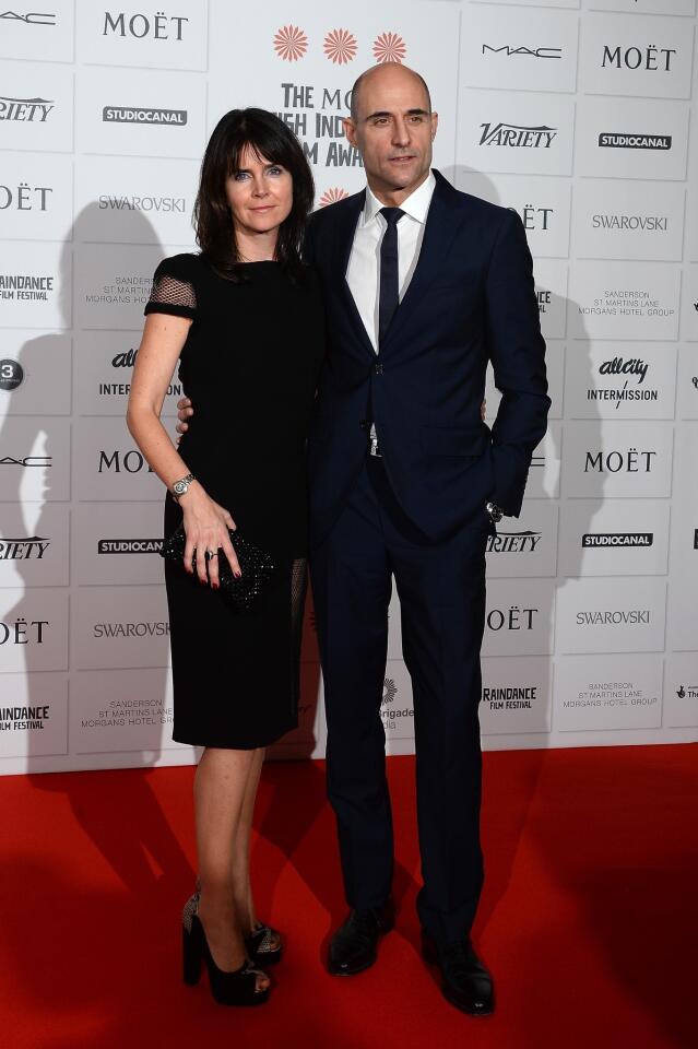 Actor Mark Strong and his wife Liza Marshall arrive on the red carpet for the Moet British Independent Film Awards at Old Billingsgate Market in London.
