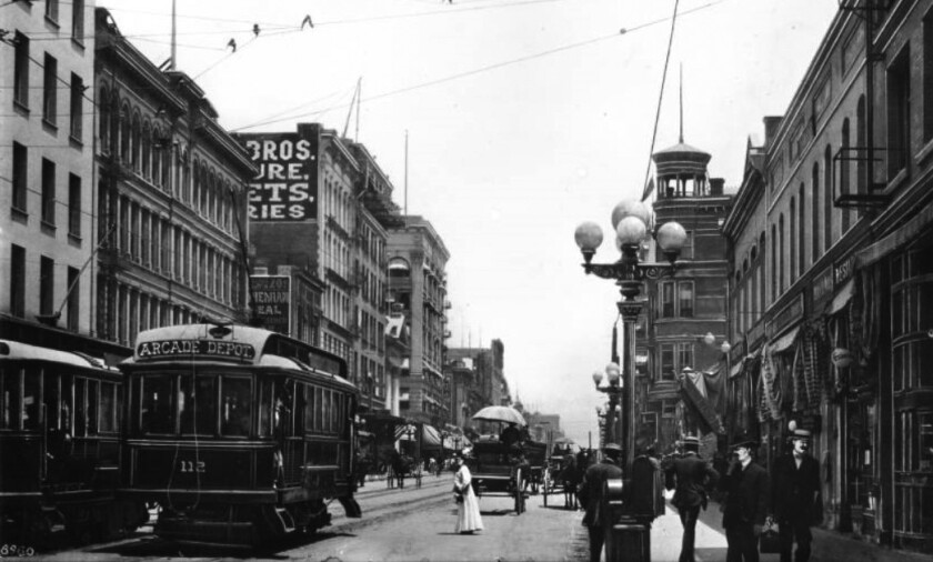 A 1905 view looking north on Main Street from Fifth Street showing five-globe standard Llewellyn streetlight.