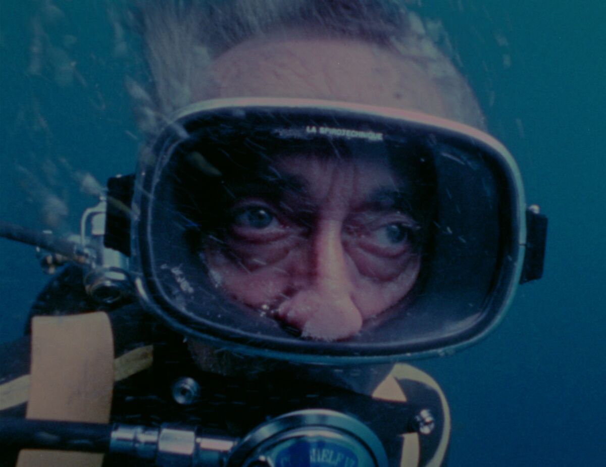 Close-up of a man underwater in scuba gear