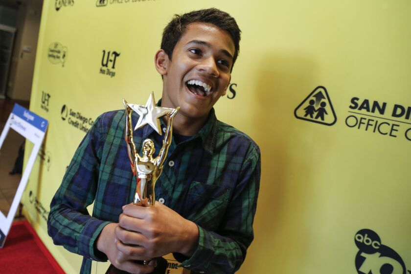 Yash Hande, a student at Pacific Trails Middle School holds his trophy after winning the 48th annual San Diego Union-Tribune Countywide Spelling Bee.