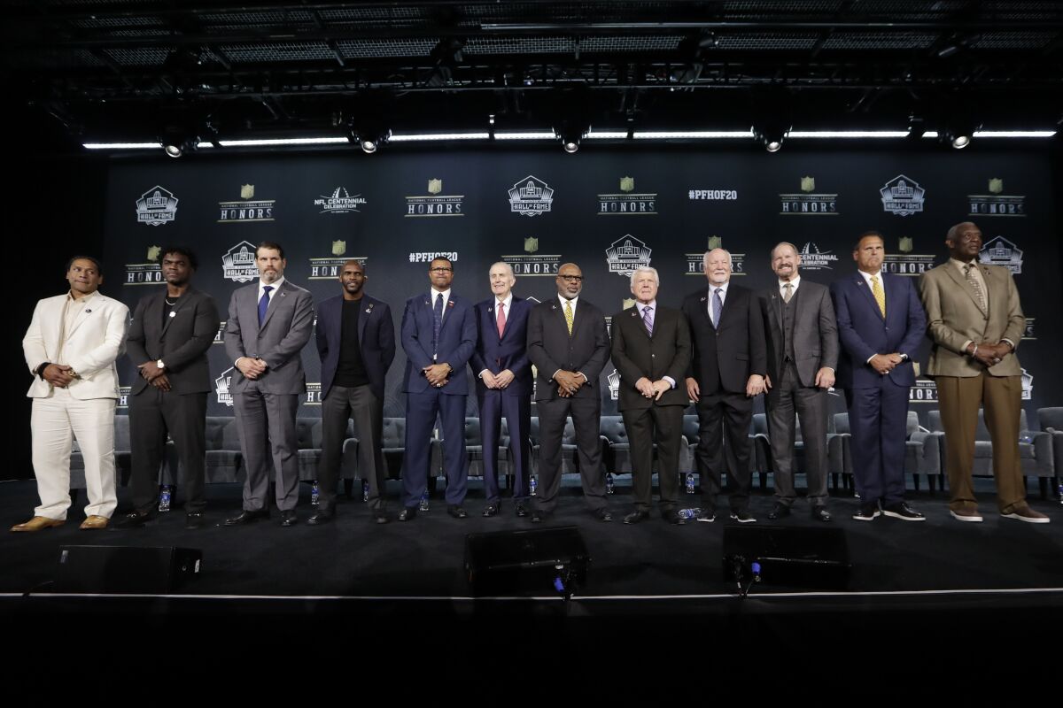 Pro Football Hall of Fame class of 2020, including Isaac Bruce (fourth from left)