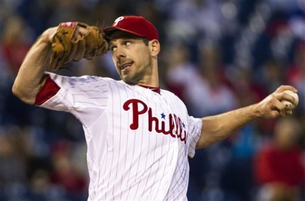 Philadelphia Phillies starting pitcher Cliff Lee works against the Miami Marlins during the first inning of a baseball game, Monday, Sept. 16, 2013, in Philadelphia. (AP Photo/Chris Szagola)