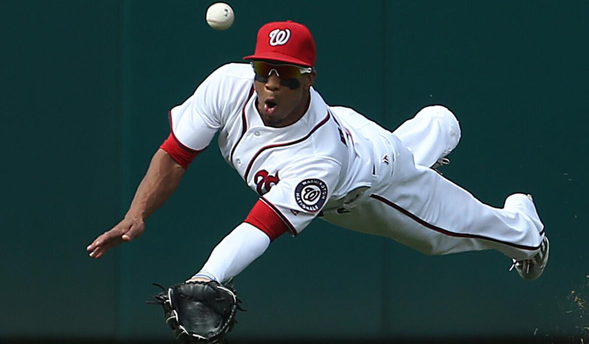 Ben Revere, then a member of the Washington Nationals, misses a catch against the Chicago Cubs on June 15.