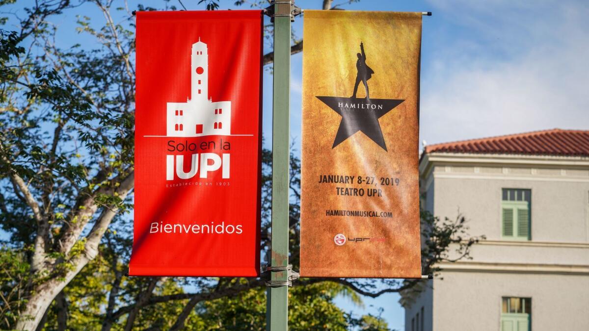 Banners on the University of Puerto Rico campus still announce the original date and location for "Hamilton," which ended up canceling the first three shows and moving to another location about five miles away.