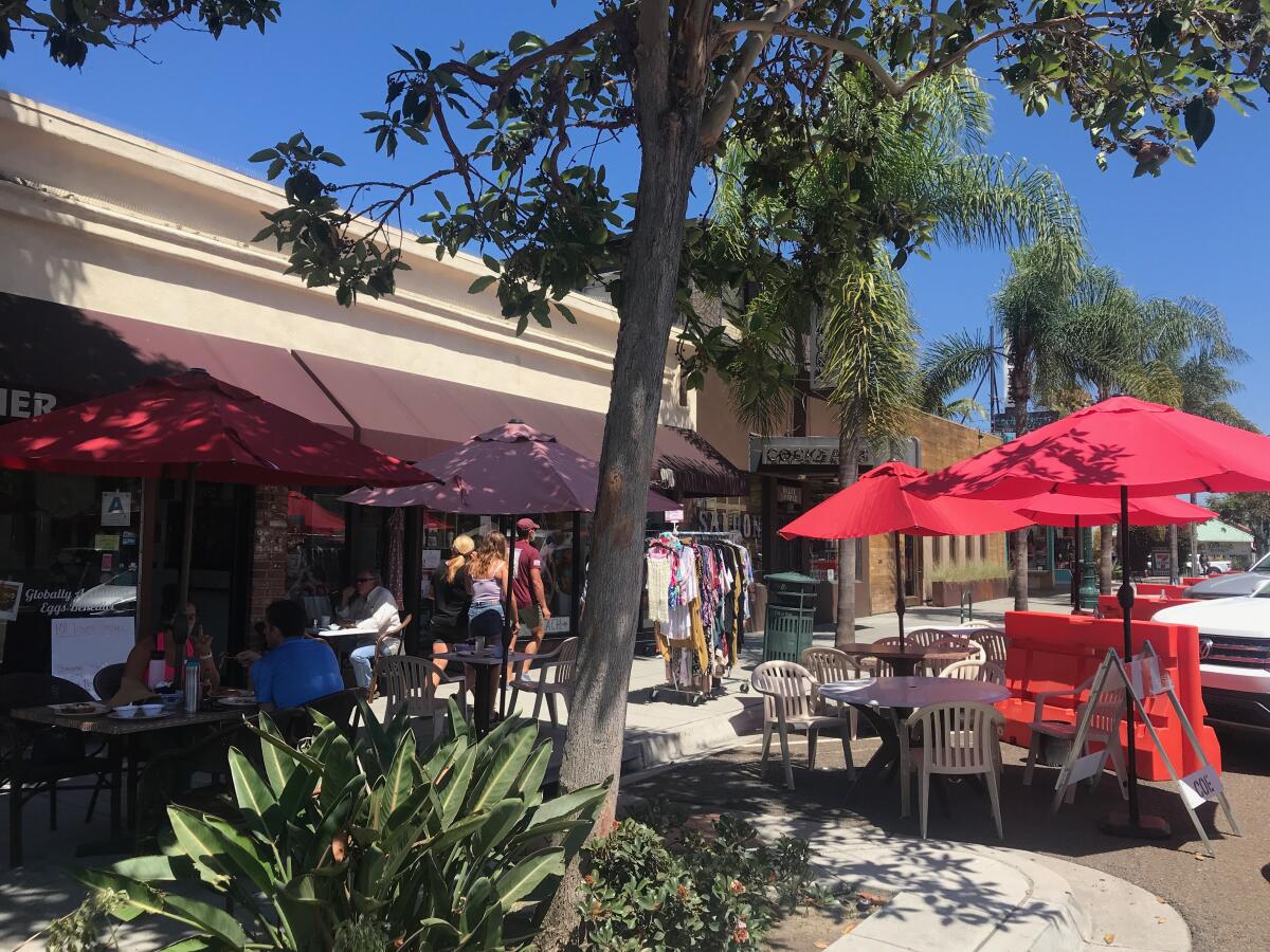 Eateries extend onto the street on Highway 101.