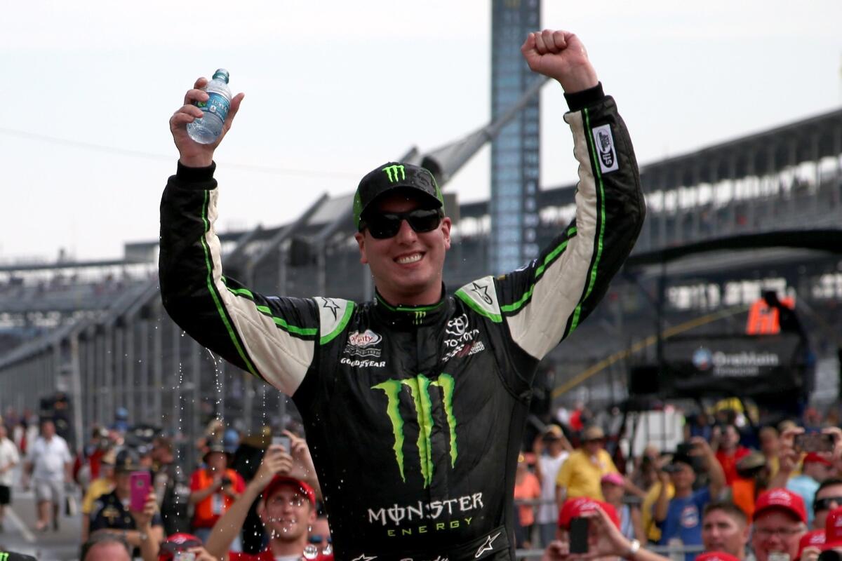 NASCAR driver Kyle Busch celebrates Saturday at Indianapolis Motor Speedway after winning the Xfinity Series race.