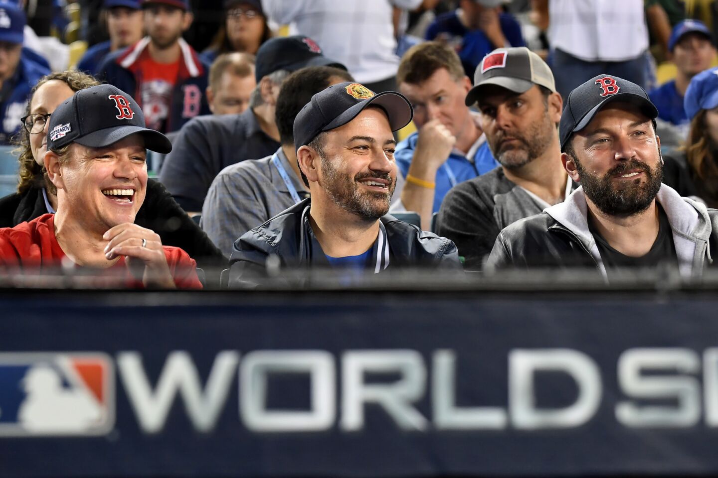 From left, Matt Damon, Jimmy Kimmel and Ben Affleck watch Game 5 at Dodger Stadium.