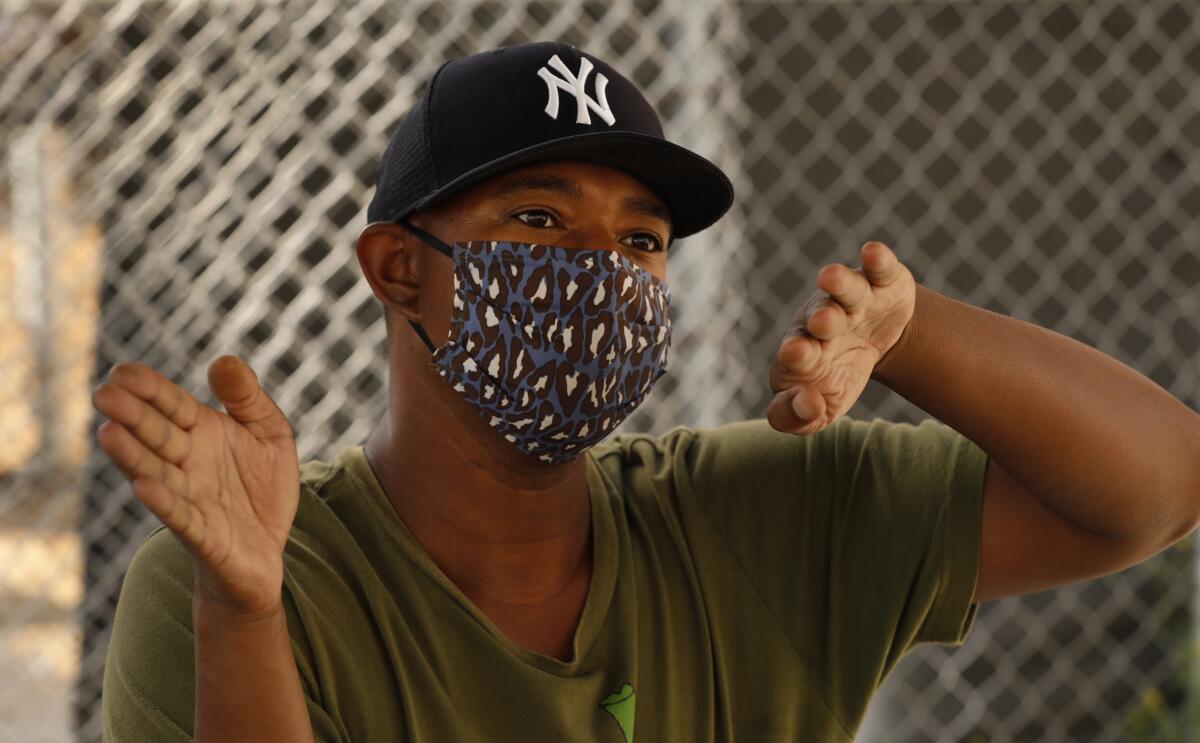 Organic nursery owner Logan Williams wears a mask at that Santa Monica Farmers Market.