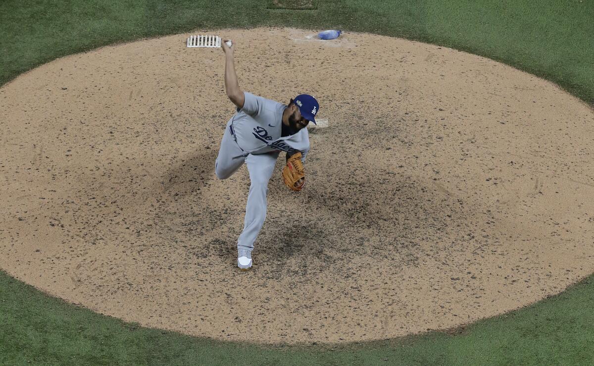 Dodgers reliever Kenley Jansen delivers a pitch during the ninth inning of a 7-3 win over the Atlanta Braves.