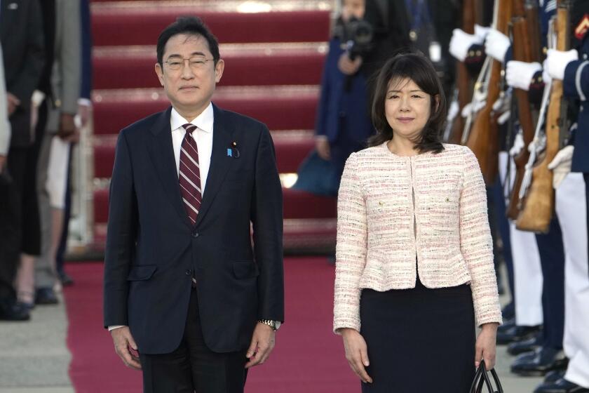 Japan's Prime Minister Fumio Kishida, left, and his wife Yuko Kishida participate in an arrival ceremony at Andrews Air Force Base, Md., Monday, April 8, 2024. Kishida is set for his much-anticipated visit to Washington, which will include a glamorous state dinner on Wednesday. The visit comes amid growing concerns about provocative Chinese military action as well as a rare moment of public difference between Washington and Tokyo over a Japanese company's plan to buy the iconic U.S. Steel. (AP Photo/Susan Walsh)