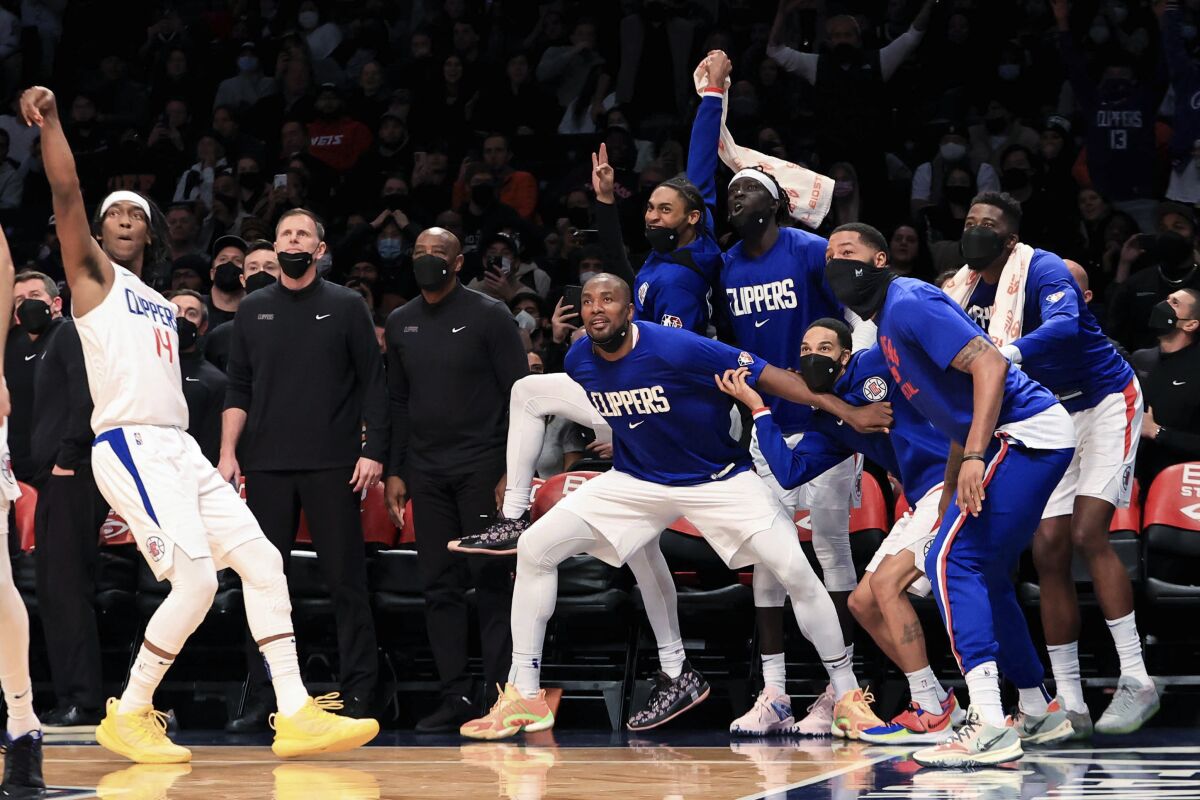 The Clippers bench reacts to a 3-point shot by guard Terance Mann against the Brooklyn Nets.