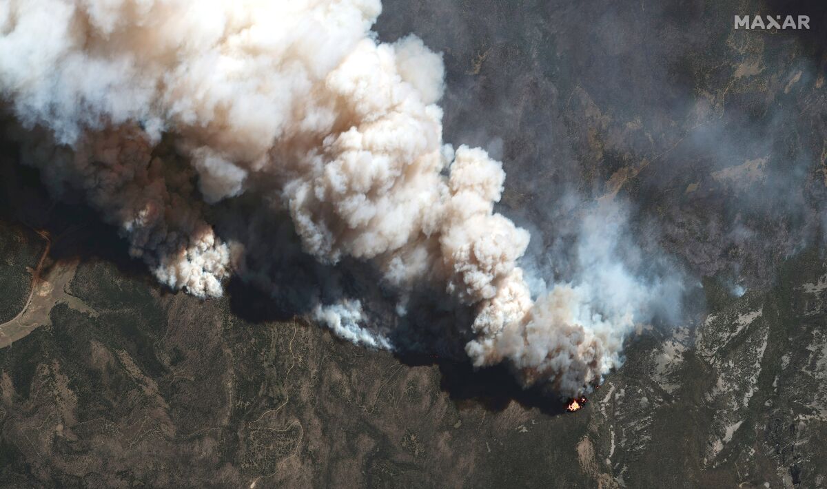 This satellite image provided by Maxar Technologies shows the active fire lines of the Hermits Peak wildfire, in Las Vegas, New Mexico, on Wednesday, May 11, 2022. Wildfire in the West is on a furious pace early this year. Wind-driven flames tearing through vegetation that is extraordinarily dry from years-long drought exacerbated by climate change has made even small blazes a threat to life and property. (Satellite image ©2022 Maxar Technologies via AP)