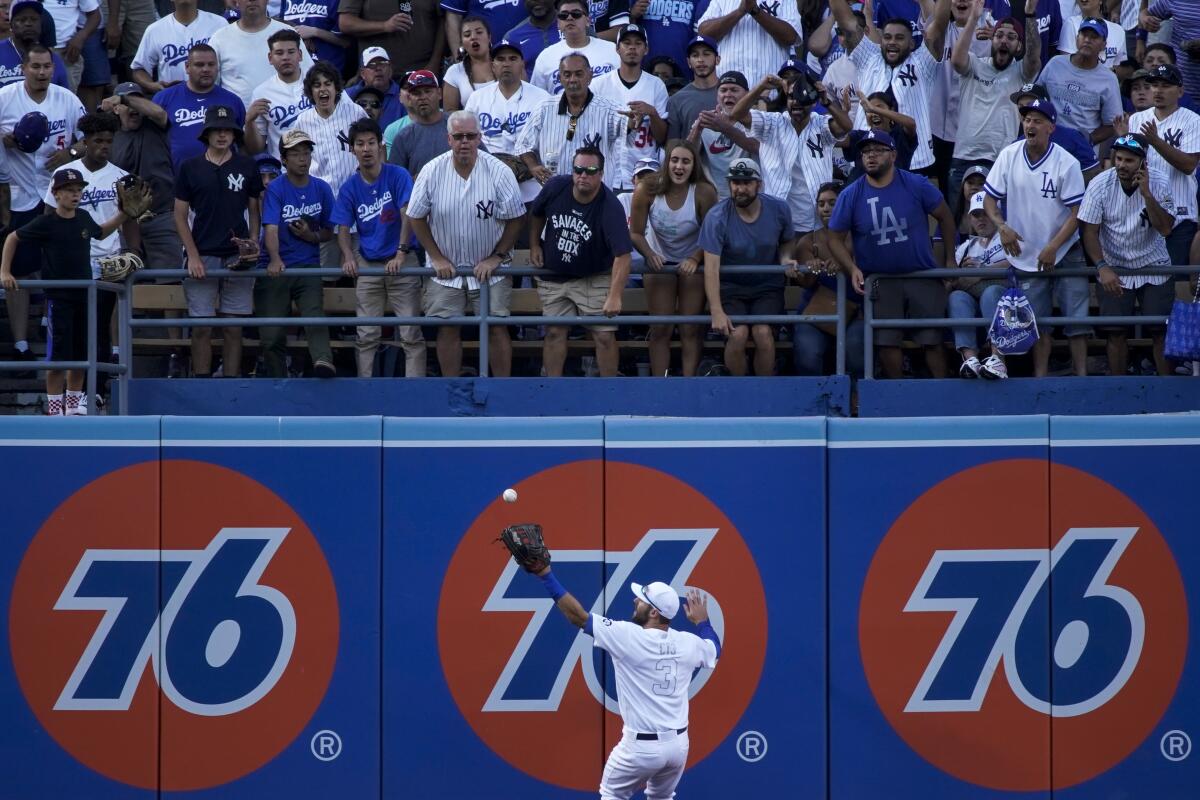 Dodgers left fielder Chris Taylor can't make the catch on a run-scoring double hit by Yankees first baseman Mike Ford during the eighth inning.