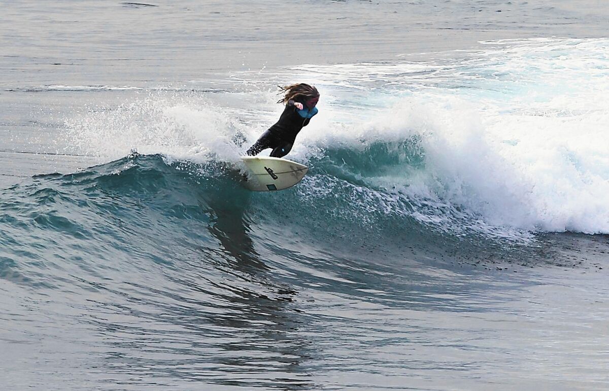 Taylor Pitz, a former junior star from Laguna Beach, surfs at her home break in Laguna.