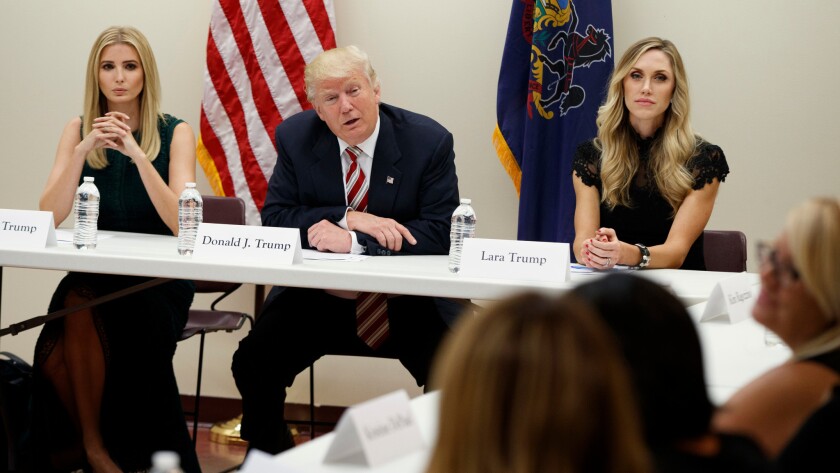 Republican presidential candidate Donald Trump is joined by his daughter Ivanka, left, and daughter-in-law Lara at a roundtable discussion on child care held Sept. 13 in Aston, Penn.
