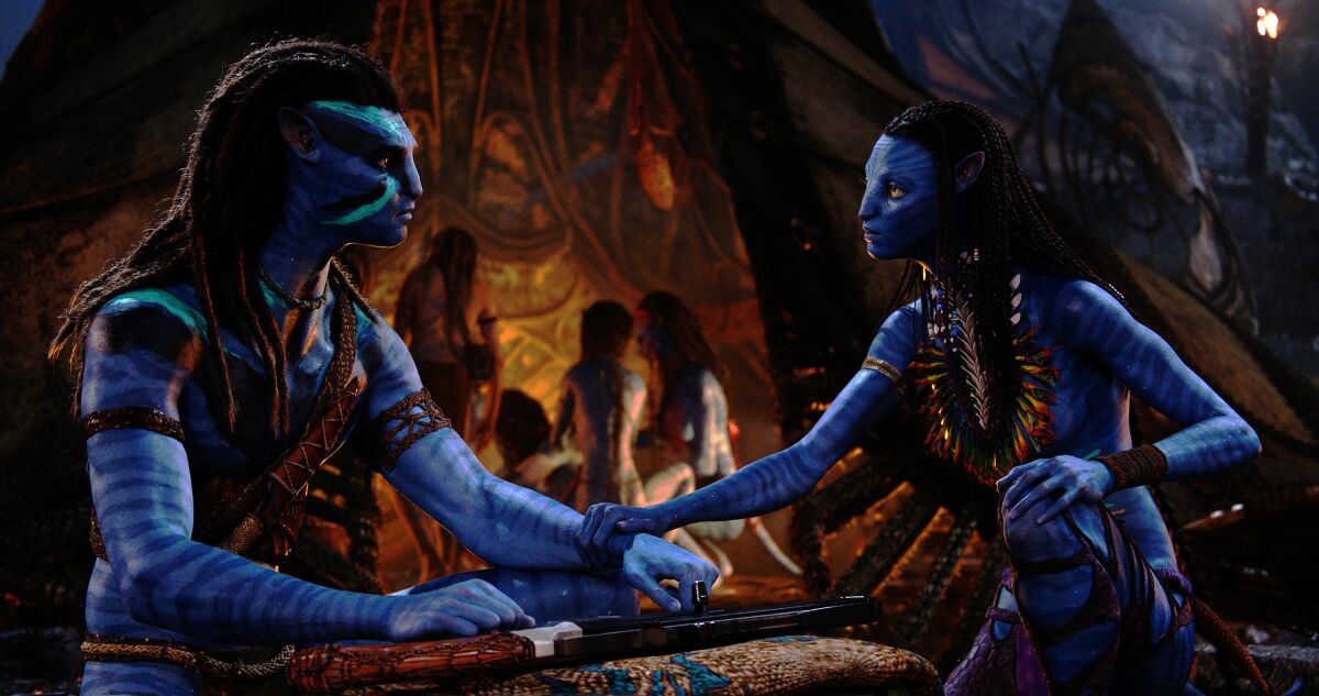 "Avatar's" blue humanoid man and woman talk face to face