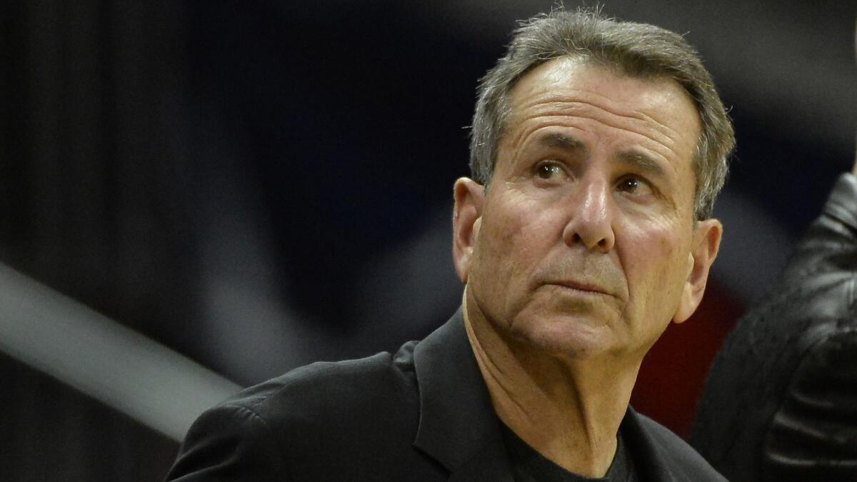 Atlanta Hawks co-owner Bruce Levenson looks on during a game against the Washington Wizards in December. Levenson is selling his stake in the team amid an NBA investigation into an "inappropriate and offensive" email he wrote.