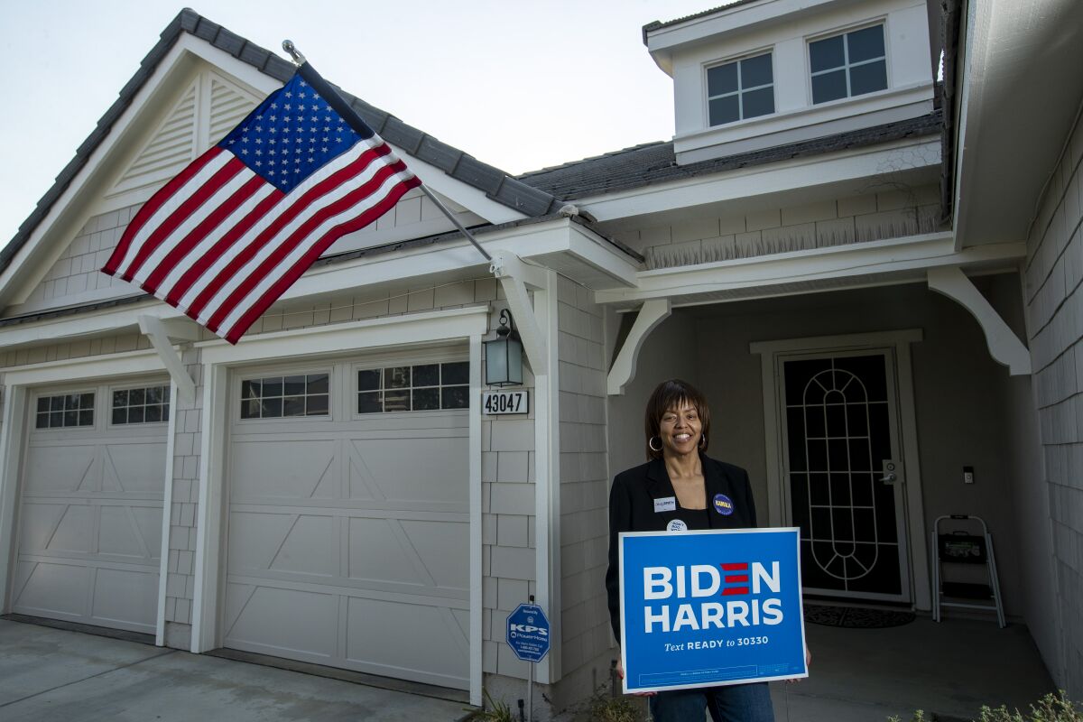 Tiffany Countryman, a human resources manager and a Biden-Harris supporter, stands in front of her Lancaster home.