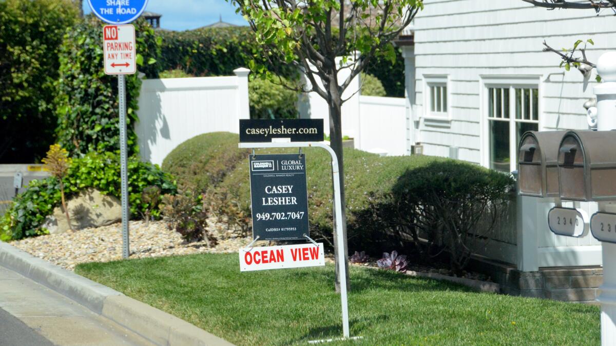 A home-sale sign that says "Ocean View"