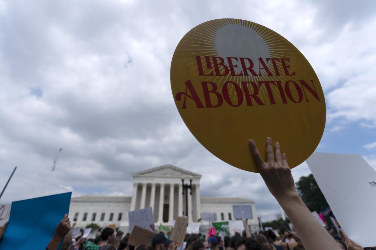 Abortion rights activists protest outside the Supreme Court 