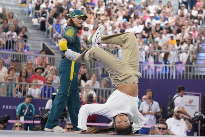 United States Logan Edra, known as B-Girl Logistx, right, and Australia's Rachael Gunn, known as B-Girl Raygun, compete during the Round Robin at the breaking competition at La Concorde Urban Park at the 2024 Summer Olympics, Friday, Aug. 9, 2024, in Paris, France. (AP Photo/Frank Franklin)