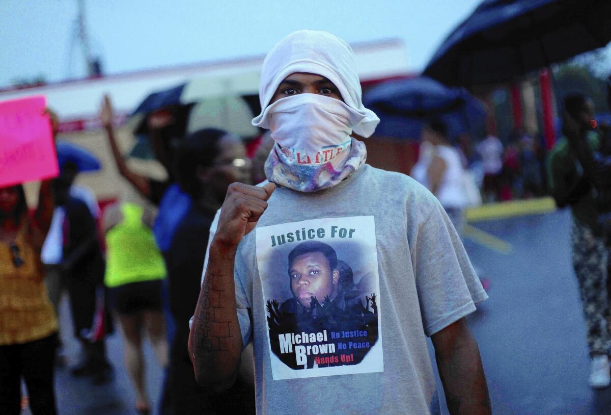A protester in Ferguson wears a shirt bearing Michael Brown's image.