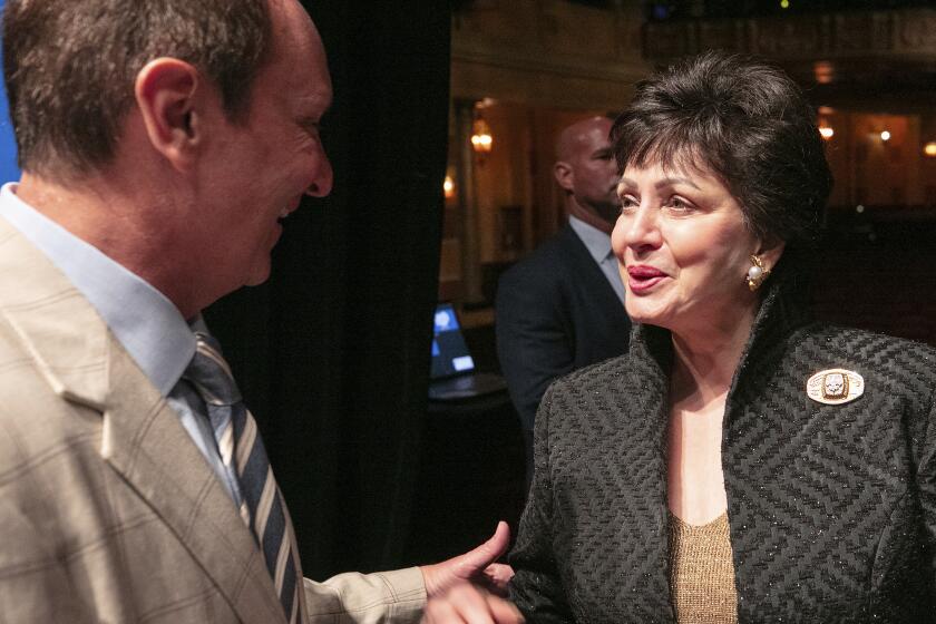 Louisiana Gov. Jeff Landry, left, speaks with New Orleans Saints owner Gayle Benson during a news conference at the Saenger Theater in New Orleans, Tuesday, June 4, 2024, about New Orlean's preparations for hosting NFL football's Super Bowl. (John McCusker/The Times-Picayune/The New Orleans Advocate via AP)