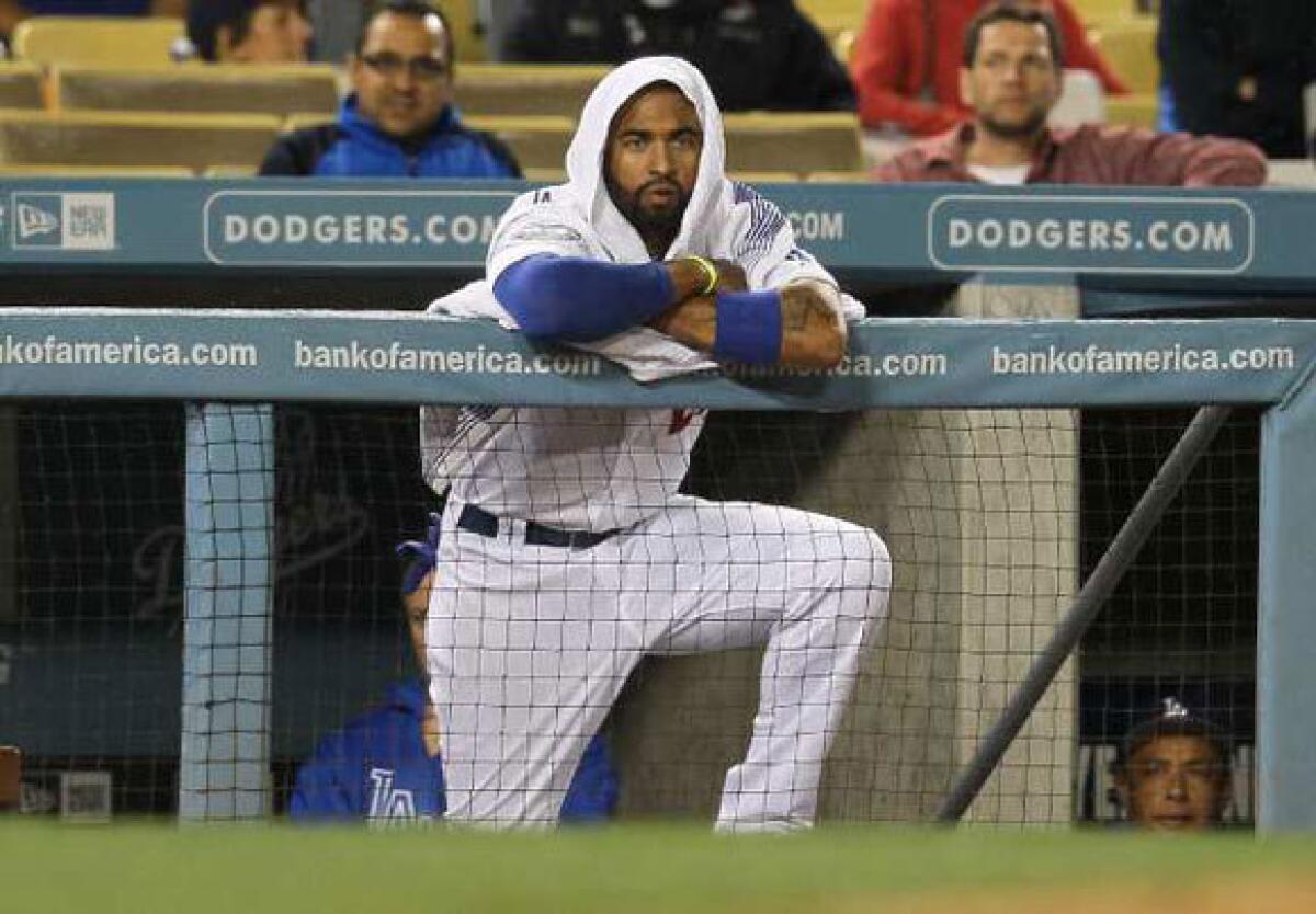 Matt Kemp wears a towel on his head while it rains during the Dodgers' April 25 game against the Atlanta Braves.