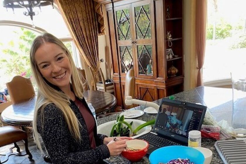 Through her company's online cooking class, Jackie Castro learned how to make pan-seared salmon with a homemade Asian salad dressing.