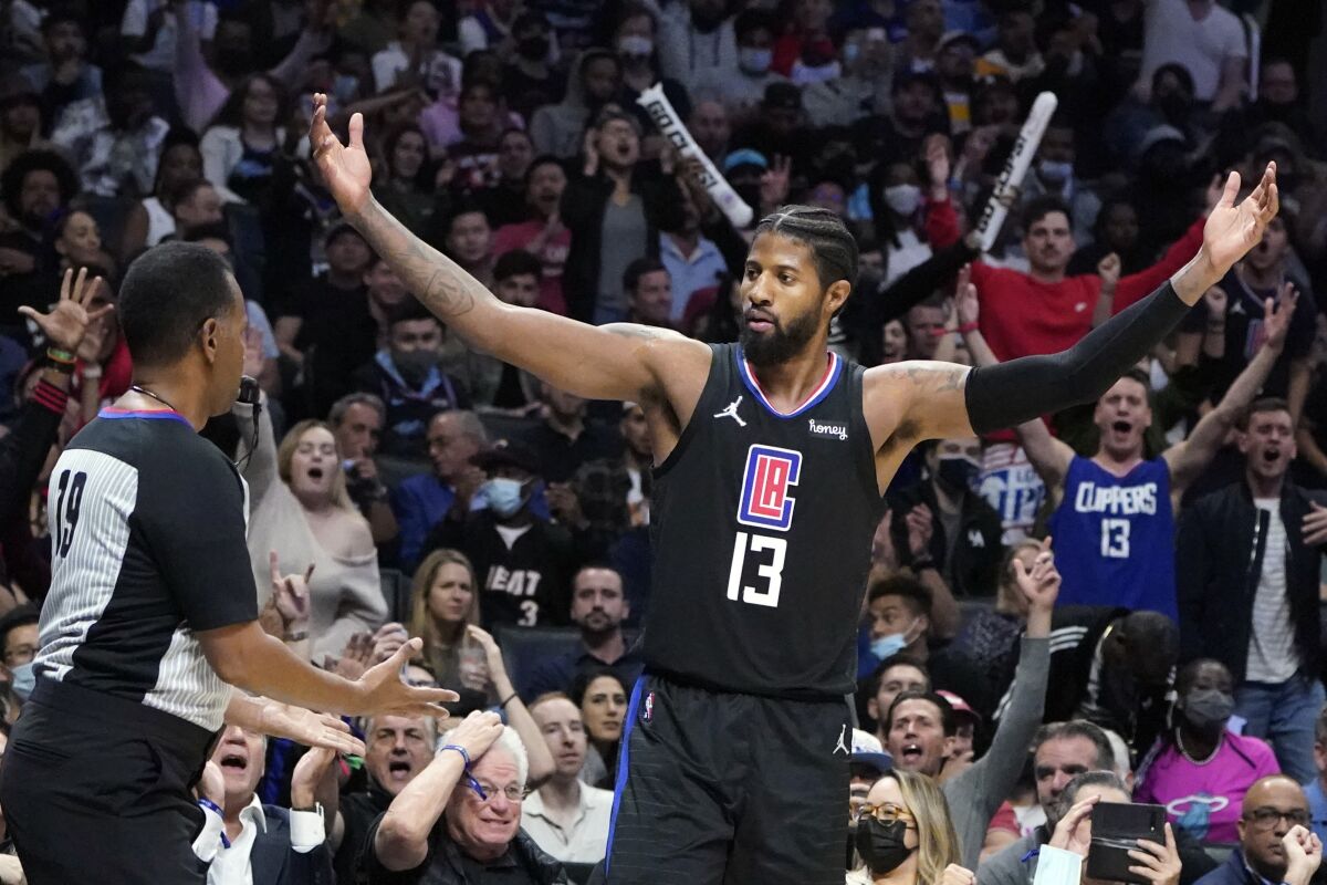 Los Angeles Clippers guard Paul George (13) asks for a foul call during the second half of the team's NBA basketball game against the Miami Heat on Thursday, Nov. 11, 2021, in Los Angeles. (AP Photo/Marcio Jose Sanchez)