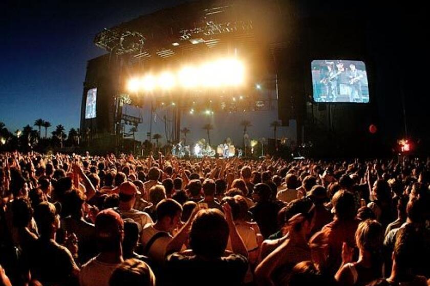 Fans fill the lawn in front of the main stage during a performance by the Jesus and Mary Chain on Friday evening.